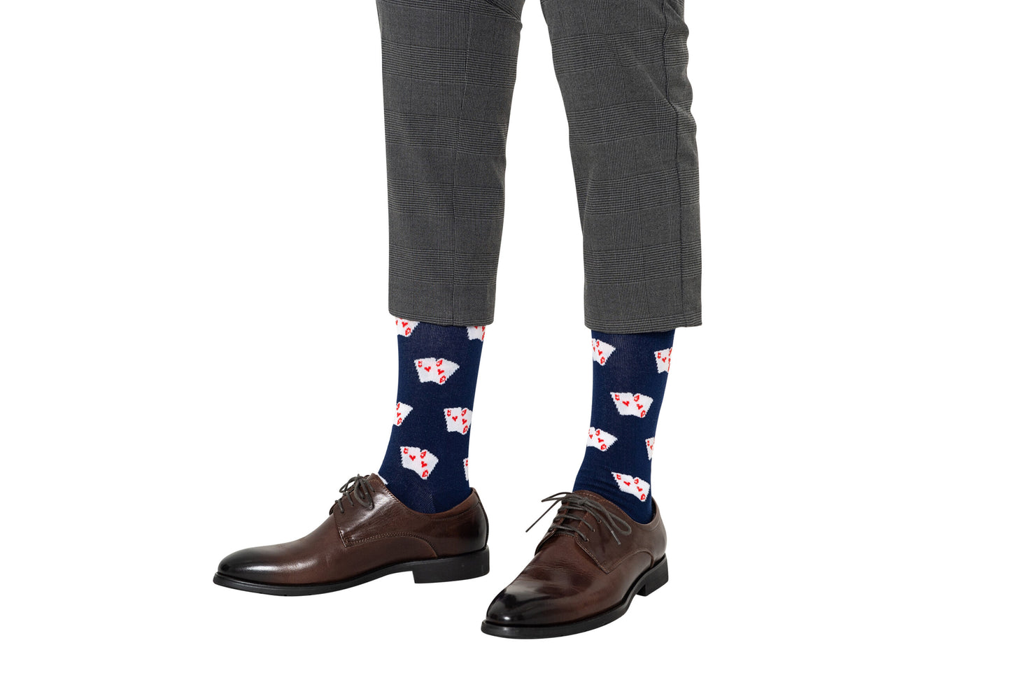 A person wears brown dress shoes, gray plaid pants, and Poker Socks with a playing card print, standing against a white background—Poker Socks make the perfect gift for poker players.