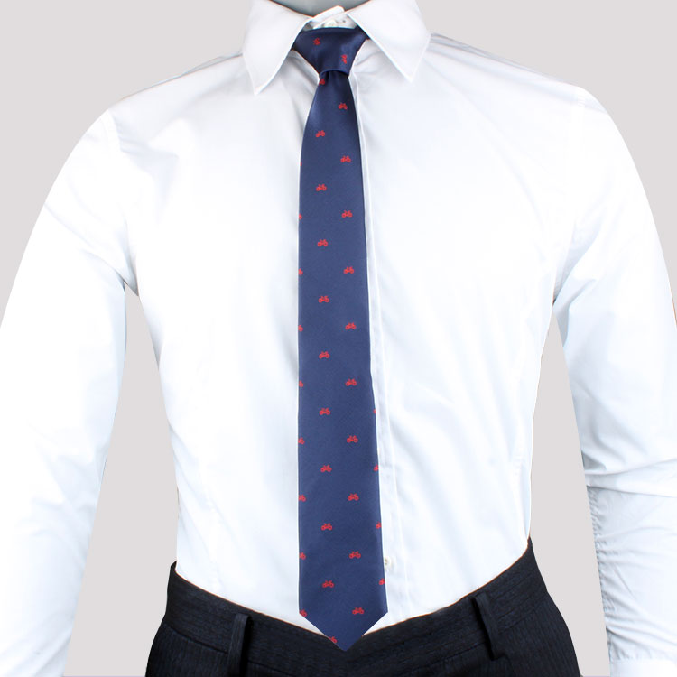 A mannequin wearing a Bike Pattern Tie and white shirt with a Cycling-themed pattern.