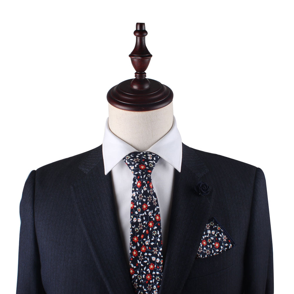 A mannequin displaying a passion for fashion with a Black Red Orange Amaryllis Floral Pocket Square.