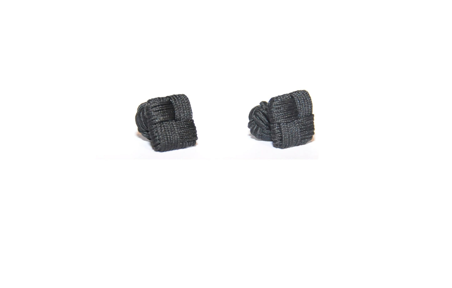 A pair of sleek black square cufflinks displayed against a crisp white background.