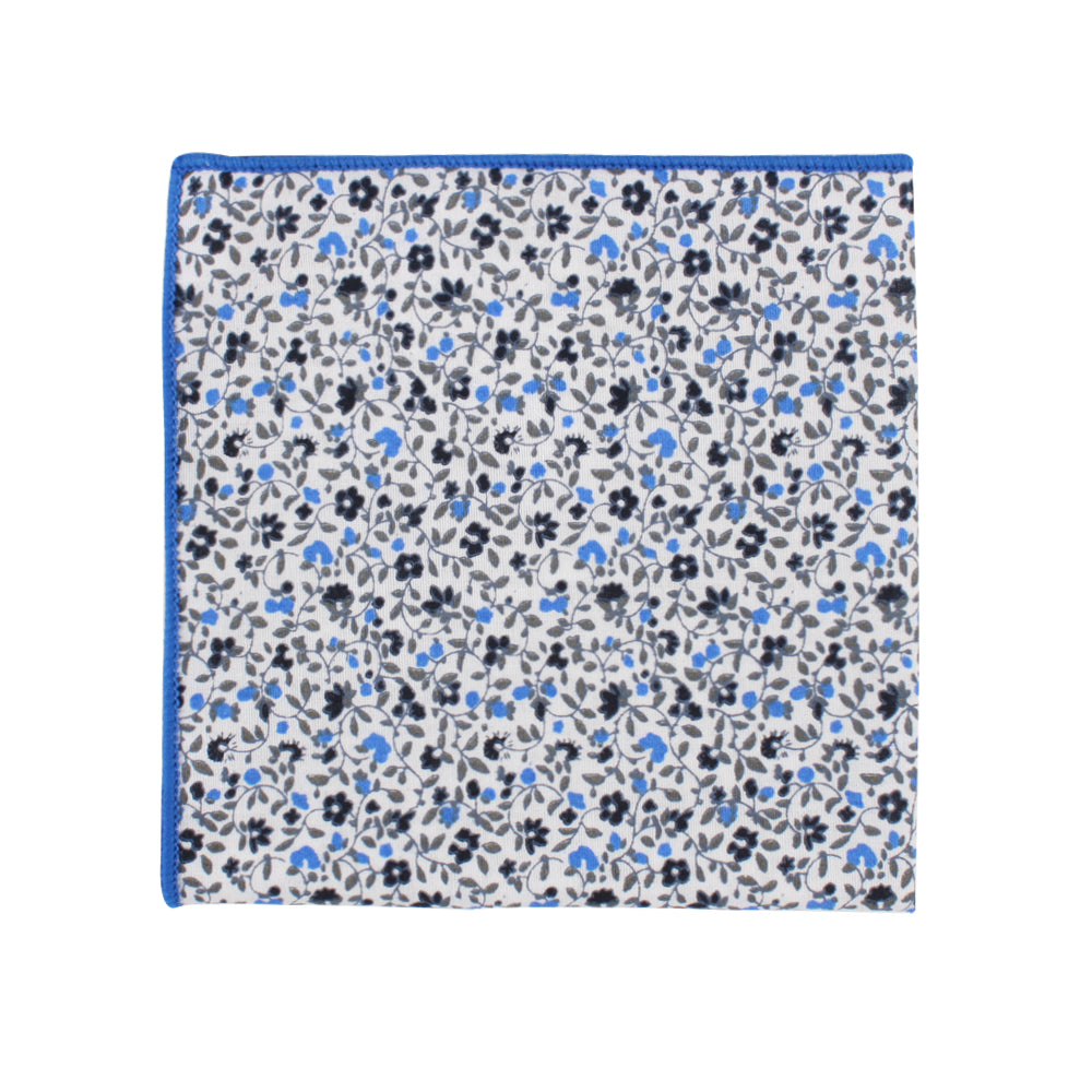 A square pocket square featuring a black and light blue floral design on a white background, with edges hemmed in blue.