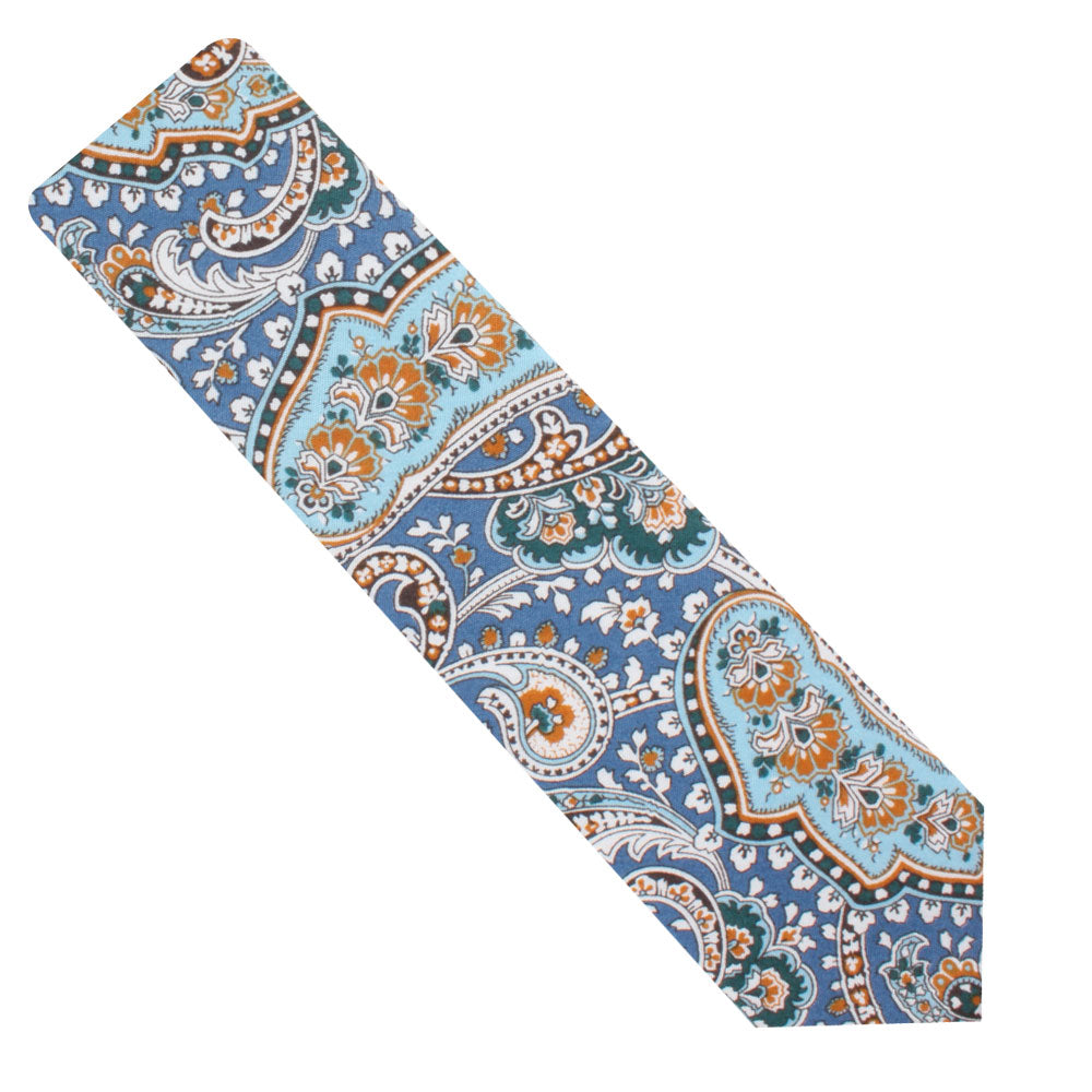 A Blue Paisley Skinny Tie adorned with a paisley pattern in orange, brown, and white.