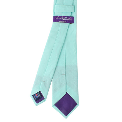 Aqua skinny tie on a white background, exuding elegance.