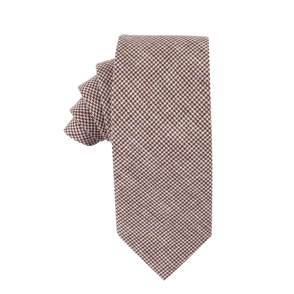 The Brown Houndstooth Cotton Business Tie, neatly folded and displayed against a white background, exudes classic elegance and timeless appeal.