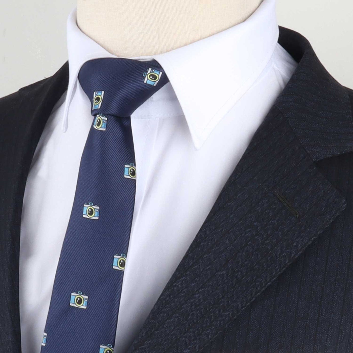 A mannequin with Camera Design Necktie wearing a blue tie.