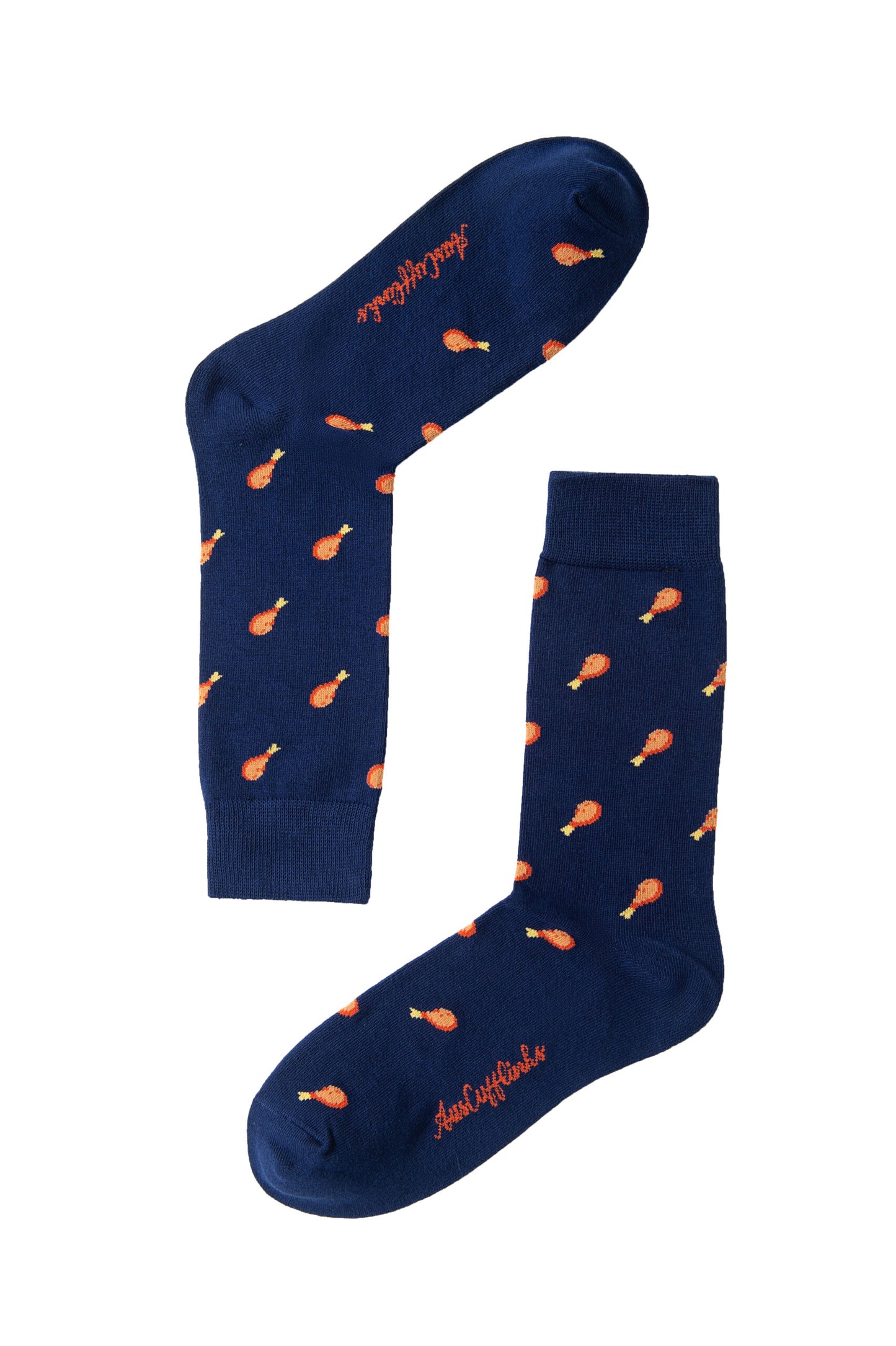 The Strawberry Cake Socks feature a playful navy blue design with an orange chicken drumstick pattern and cursive text on the soles, perfect for adding a whimsical touch to your layered style.
