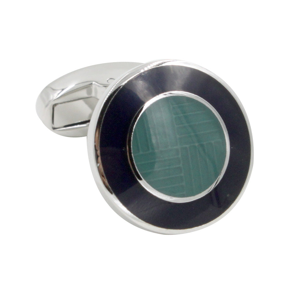 A pair of Circular Teal Cufflinks with a black and green inlay, adding an oceanic charm to any ensemble.