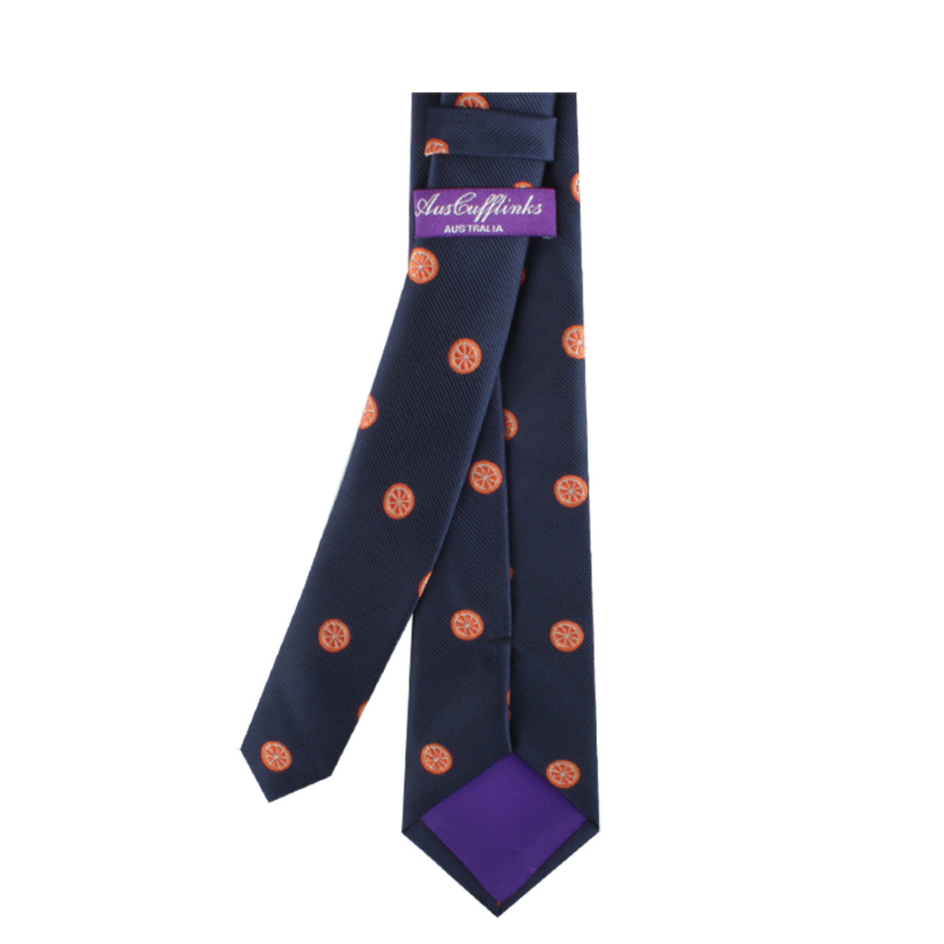 An Orange Skinny Tie featuring small orange circular patterns and a purple rear loop with the text "AustCufflinks Australia." The vibrant back lining of the tie is also purple.