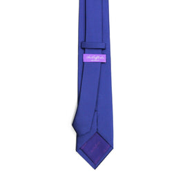 A Classic Navy Skinny Tie with a purple tag on it.