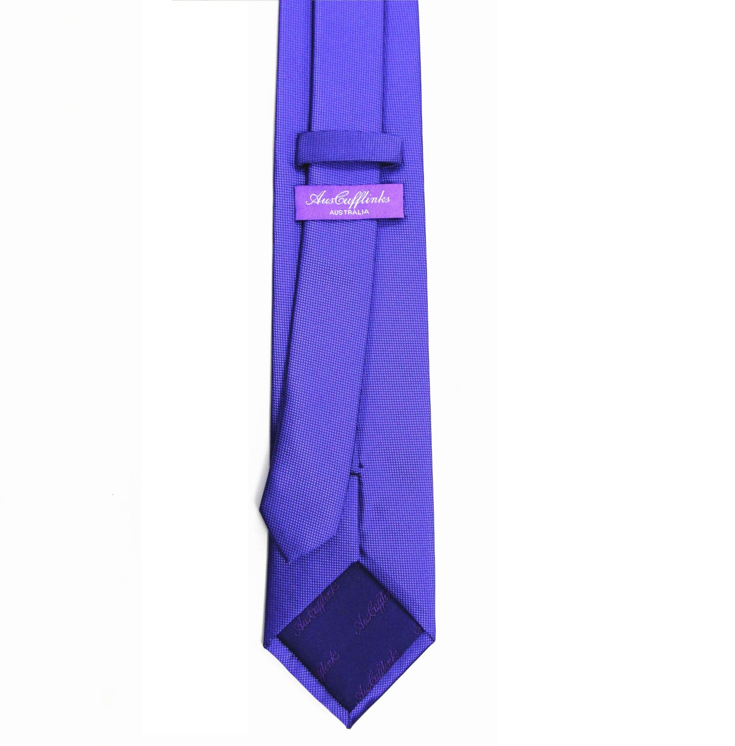 The Classic Purple Skinny Tie embodies timeless style with its subtle checkered pattern, exuding purple elegance and featuring a label reading "Andre Emilio" on the reverse side.