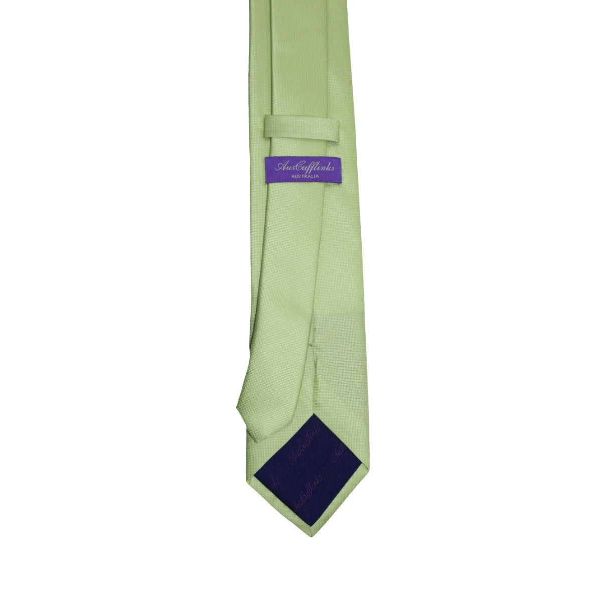 Introducing the Classic Lime Green Skinny Tie, featuring a fresh green hue with a purple label and text on the back, perfect for adding a touch of spring style to your wardrobe.