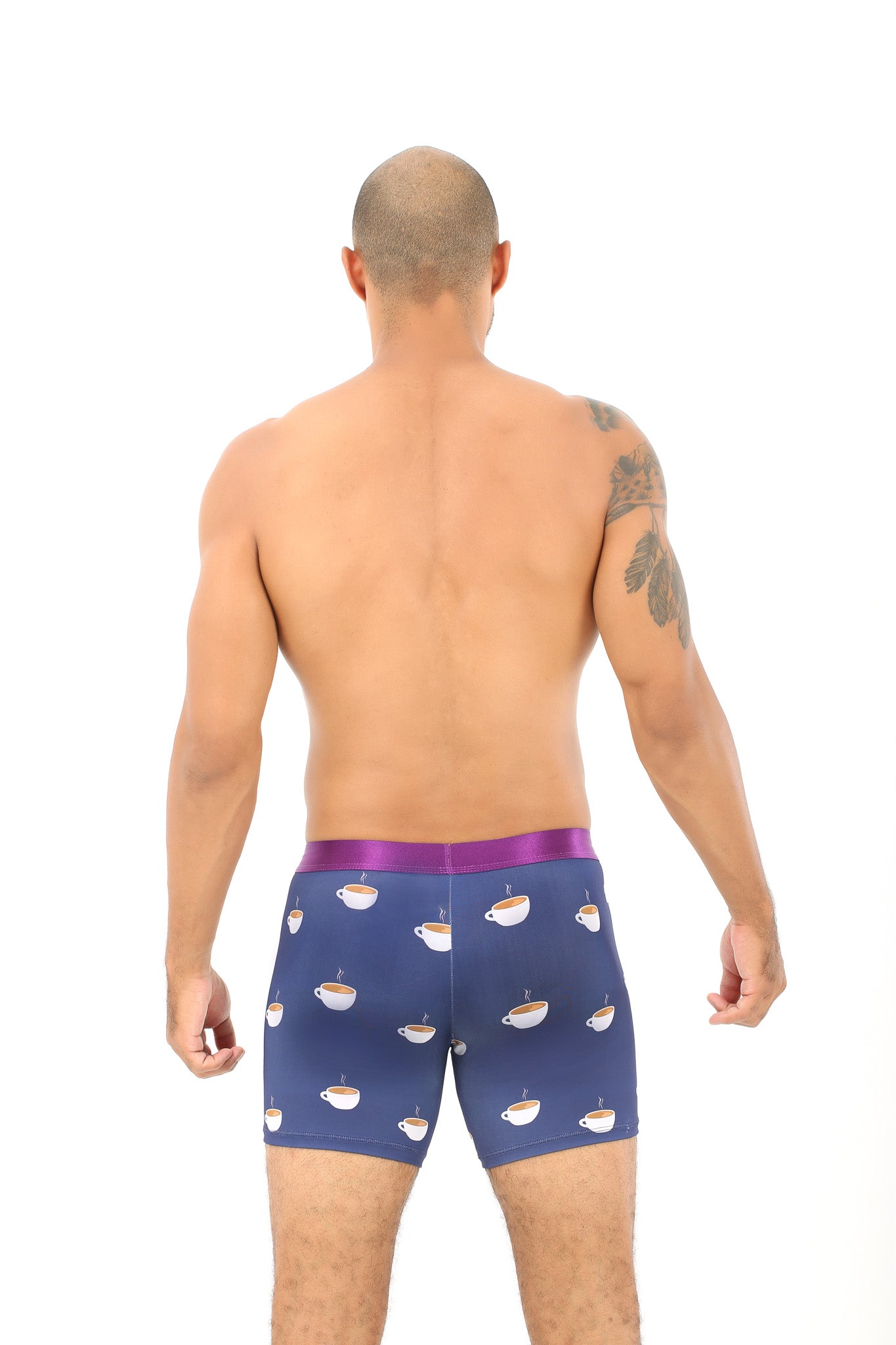 The back of a man wearing Coffee Boxer with maximum coziness and cupcakes on it.