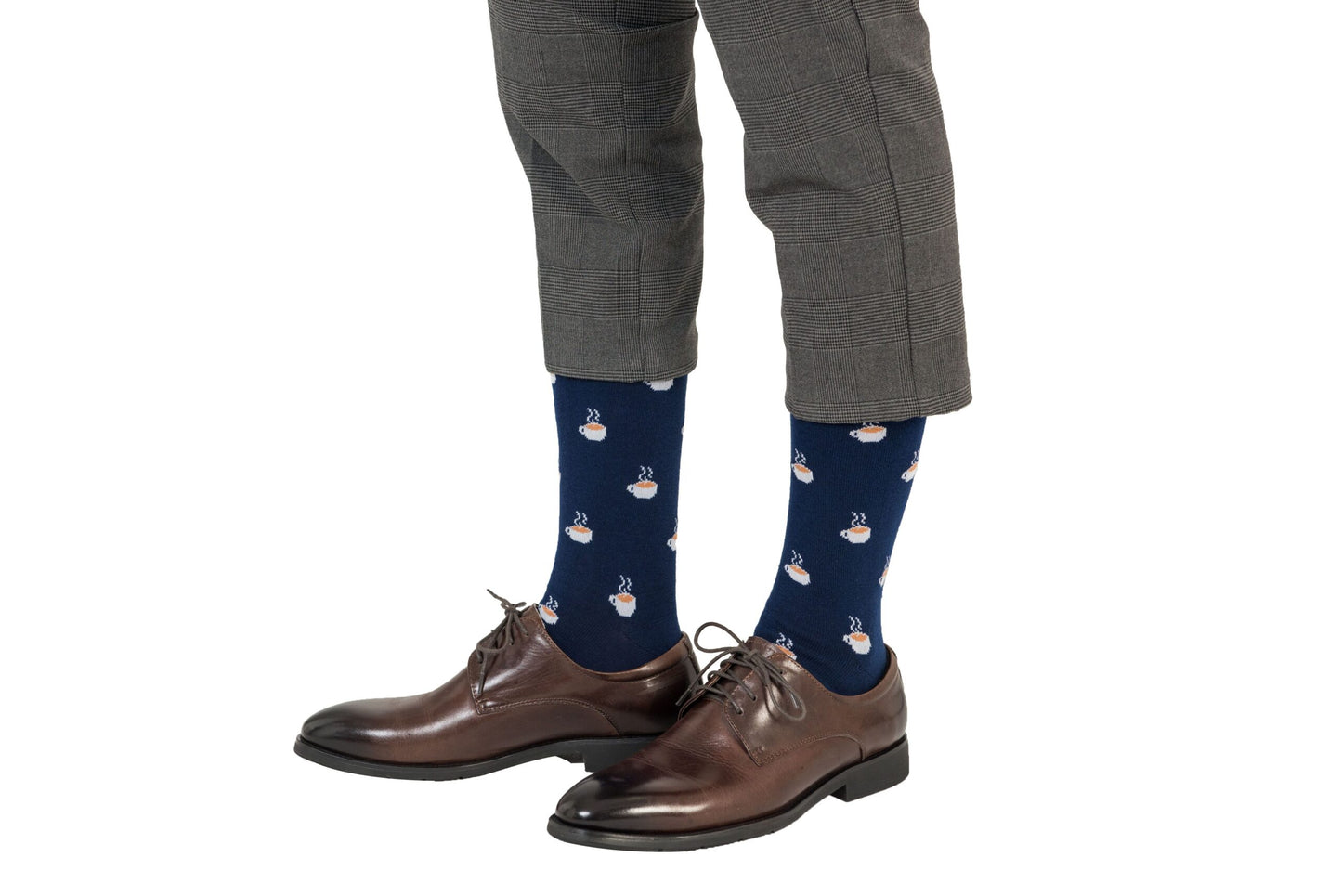 A man wearing a pair of brown Coffee Socks and shoes.