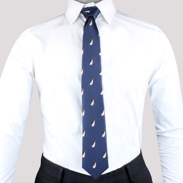 A person wearing a white dress shirt with a Cold Climate Tie, exuding whimsical charm and timeless elegance.