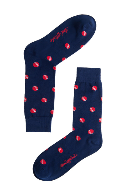 A pair of Cricket Socks with red dots.