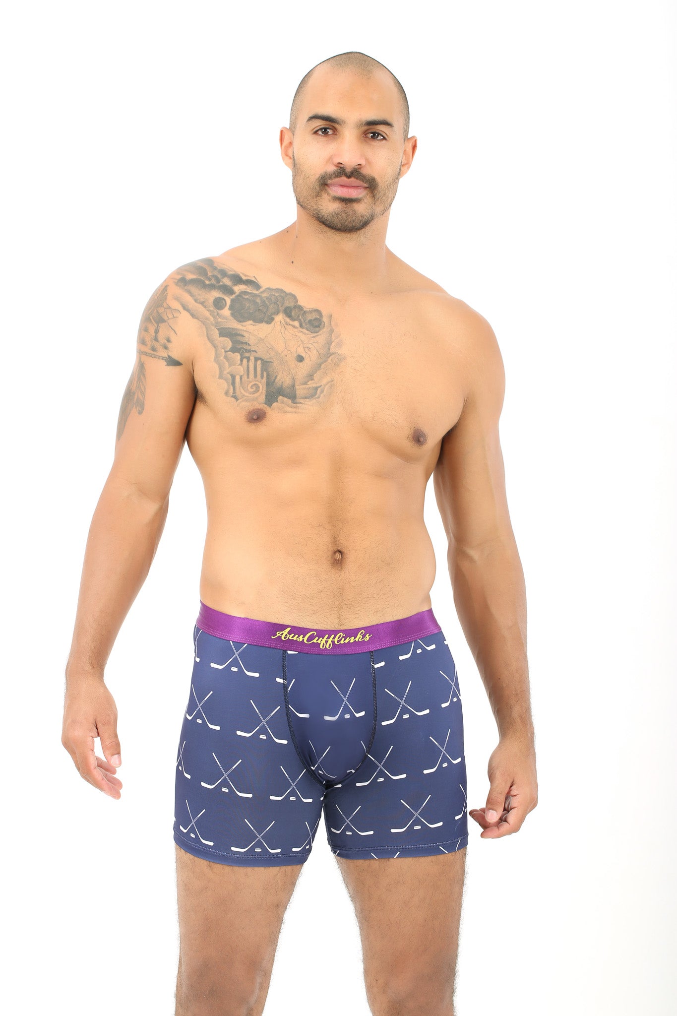 A man wearing Crossed Ice Hockey Boxer stands against a plain white background, embodying the ultimate goal of coziness.