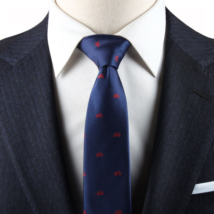 A mannequin wearing a suit and tie with a Cycling Print TIe pattern.