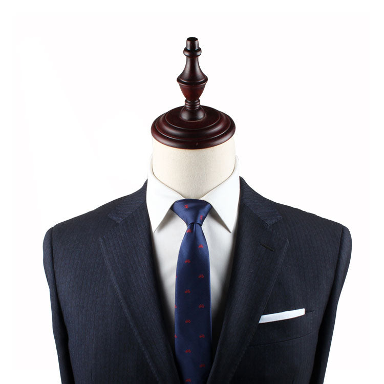 A suit and the Cyclist Slim Tie on a mannequin dummy.