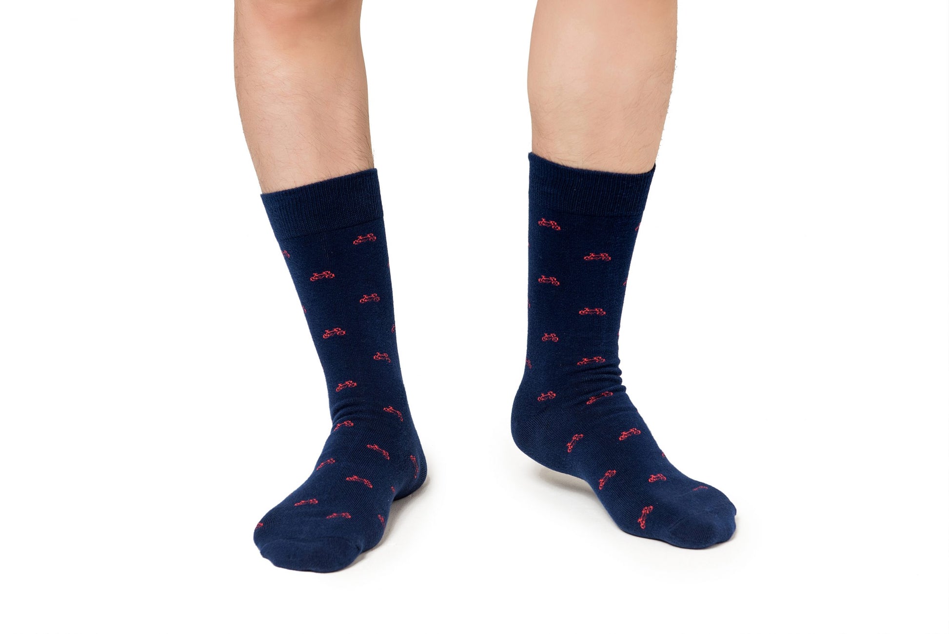 A man wearing a pair of Cyclist Bike Socks with red birds on them.