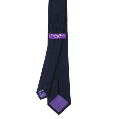 A Dark Forest Navy Business Cotton Tie with purple stripes.