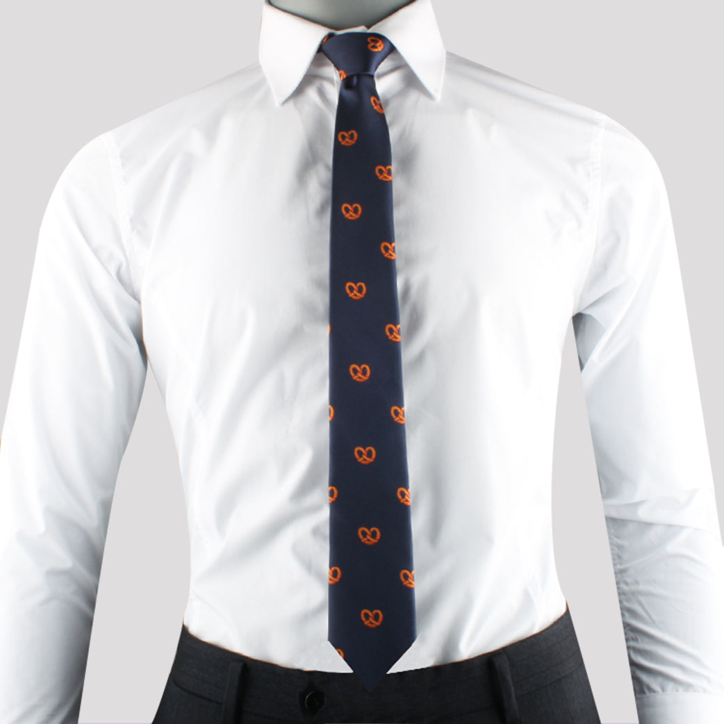 A person wearing a white dress shirt, dark trousers, and a Deli Inspired Necktie exudes contemporary style.