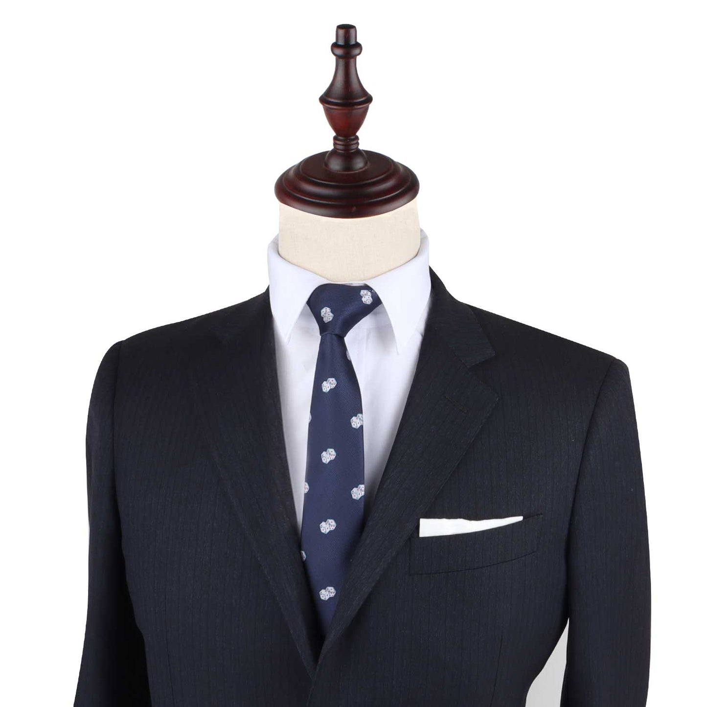 A mannequin displaying a dark suit with a white shirt and the Dice Print Tie featuring a light blue pattern exudes an effortless style.