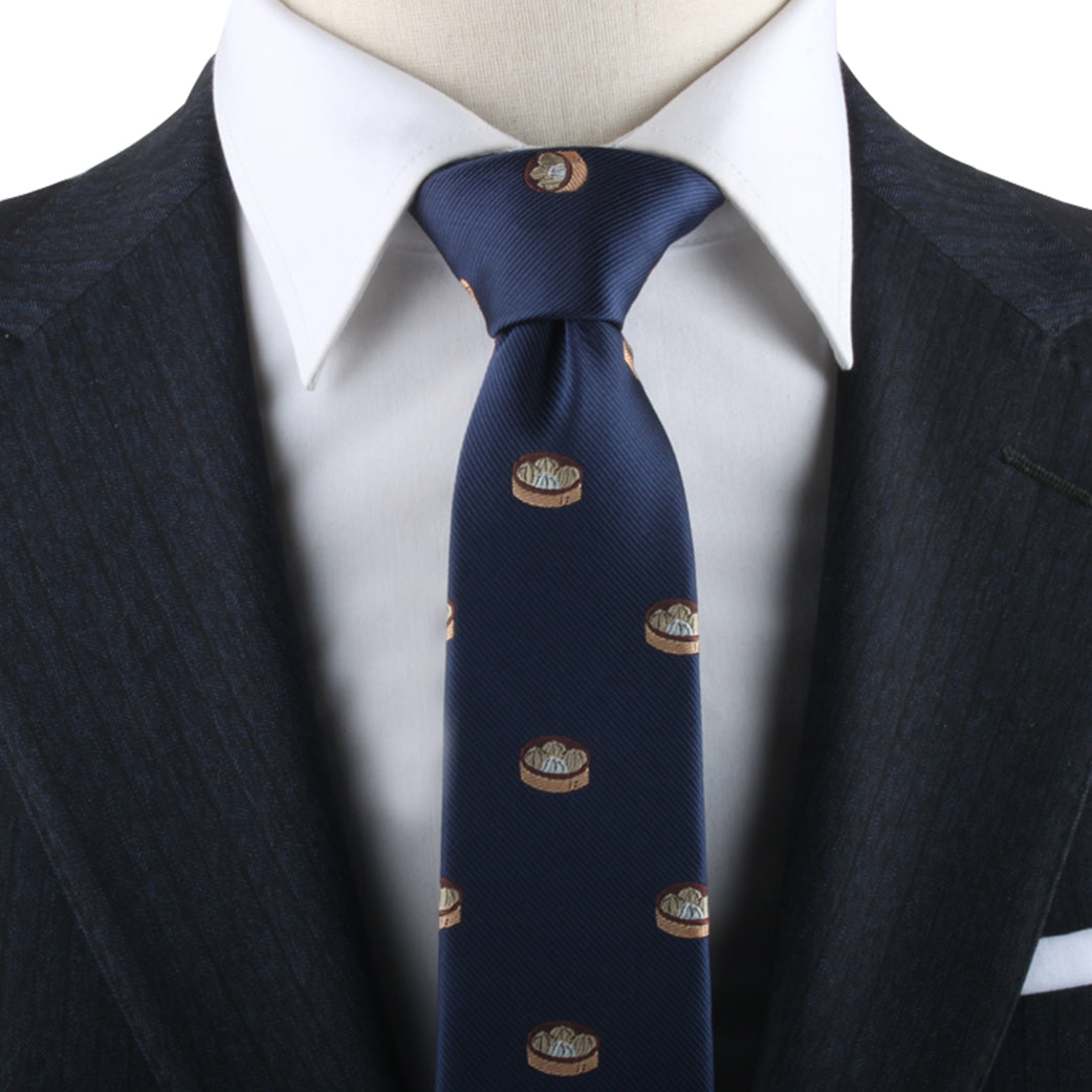 Close-up of a person wearing a Dumplings Necktie, a white dress shirt, and a dark pinstripe suit jacket, exuding timeless elegance.