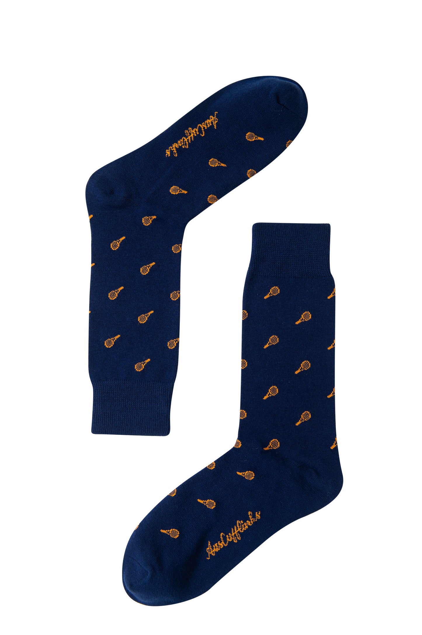 The Orange Tennis Socks are navy blue with a repeating racket print and orange script text near the toes.