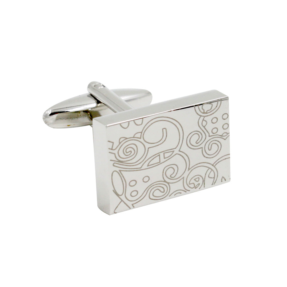 Paisley Cufflinks – Sleek & Modern Style for Men: Rectangular silver cufflink featuring an abstract engraved swirl and dot design, offering classic sophistication—an ideal gift for him. Shown on a white background.