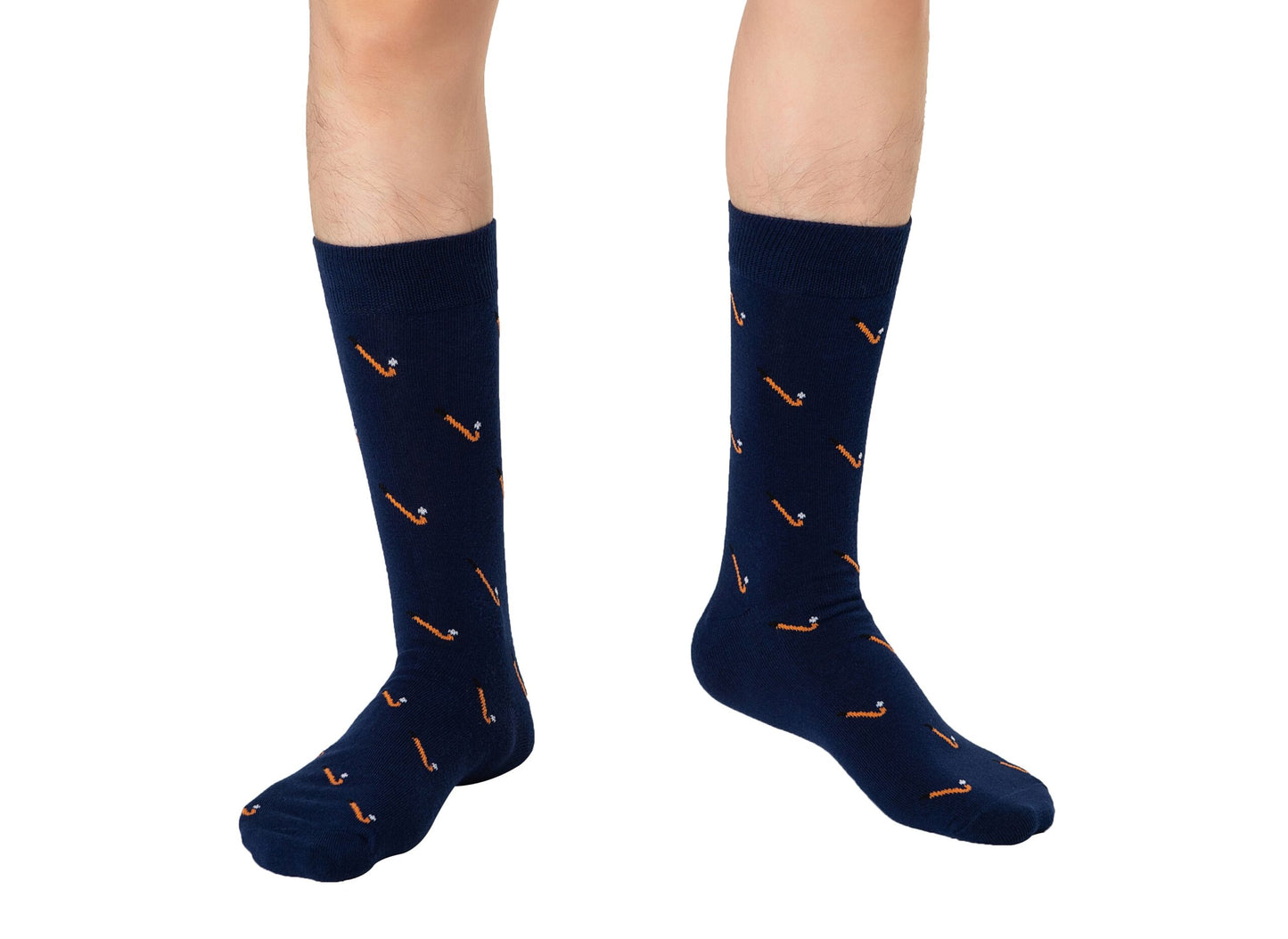 Someone stands on a white background wearing Field Hockey Socks in navy blue, featuring a moisture-wicking design and a small orange and white pipe pattern.