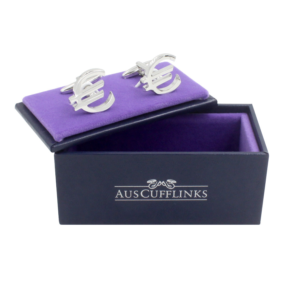 Housed in a purple "AUSCUFFLINKS" box, Euro Cufflinks are silver accessories elegantly shaped like the currency symbol, perfect for those intrigued by international trade, adding global flair to any ensemble.