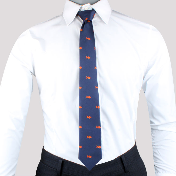 A person wearing a white dress shirt and dark pants, with a Fish Motif Tie featuring an artistic charm of small orange goldfish design.