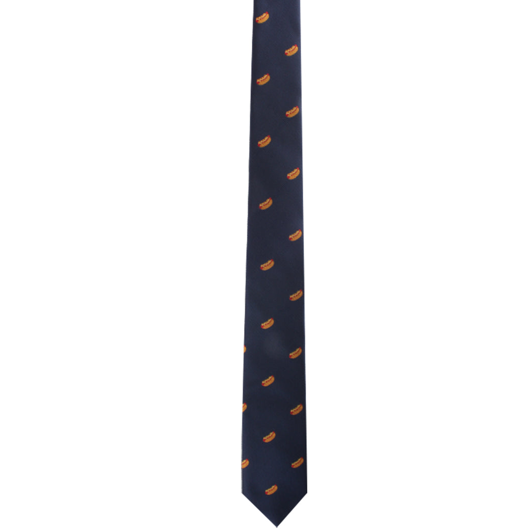 The Food Print Skinny Tie in navy showcases small orange hot dog motifs, evenly spaced to infuse any outfit with a culinary charm.