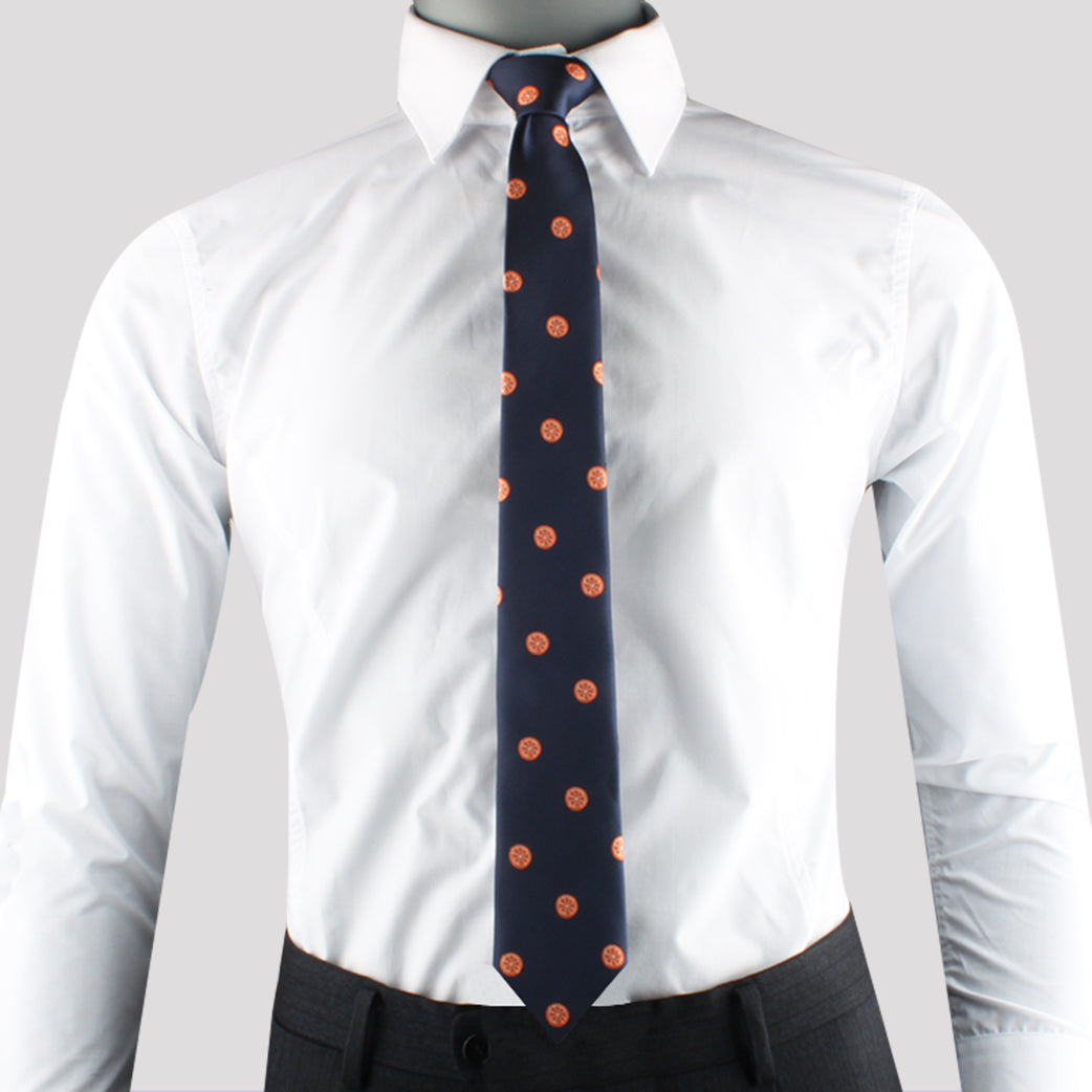 A person wearing a white dress shirt, an Fresh Fruit Tie, and dark trousers. The head is not visible.