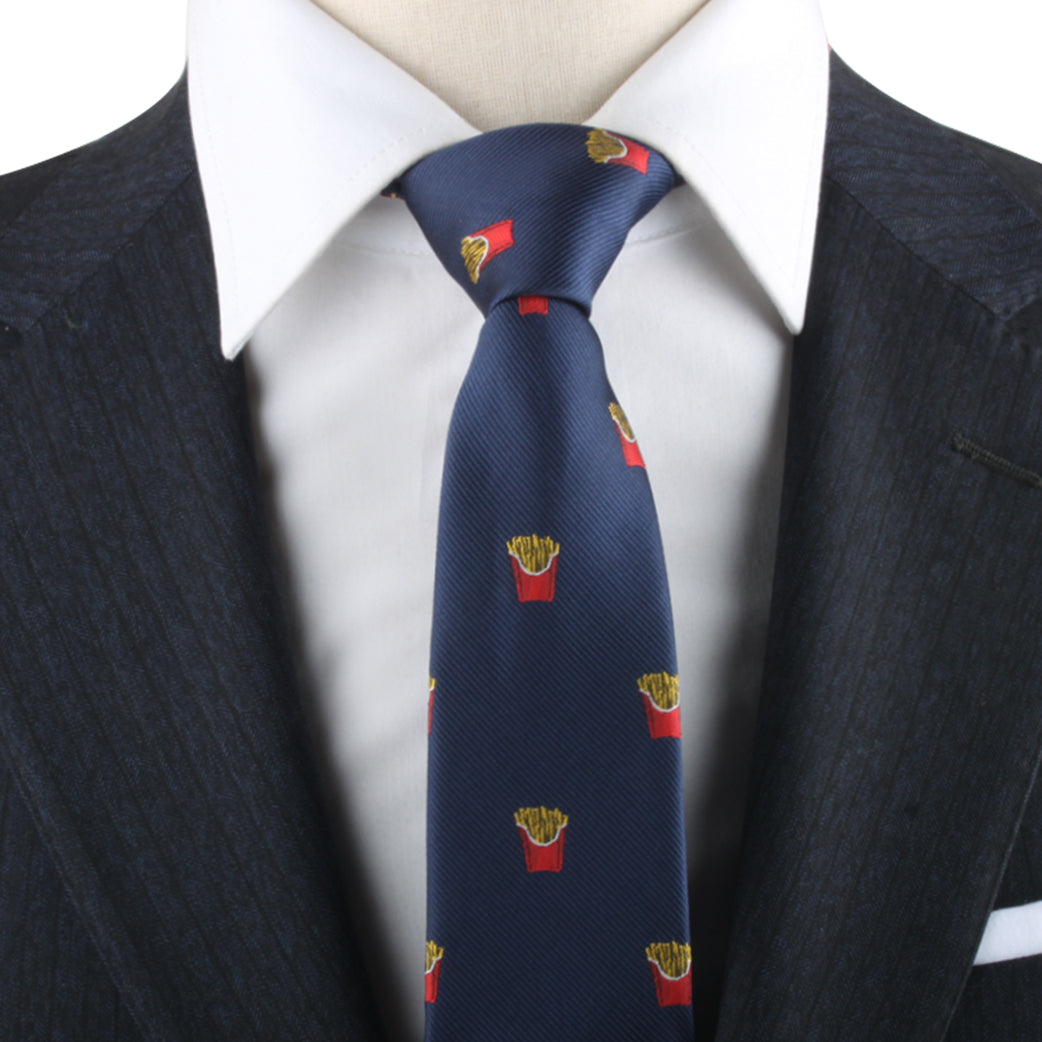 Close-up of a person wearing a dark suit with a white shirt and the Fries Necktie, adorned with small French fry containers, exuding modern sophistication.