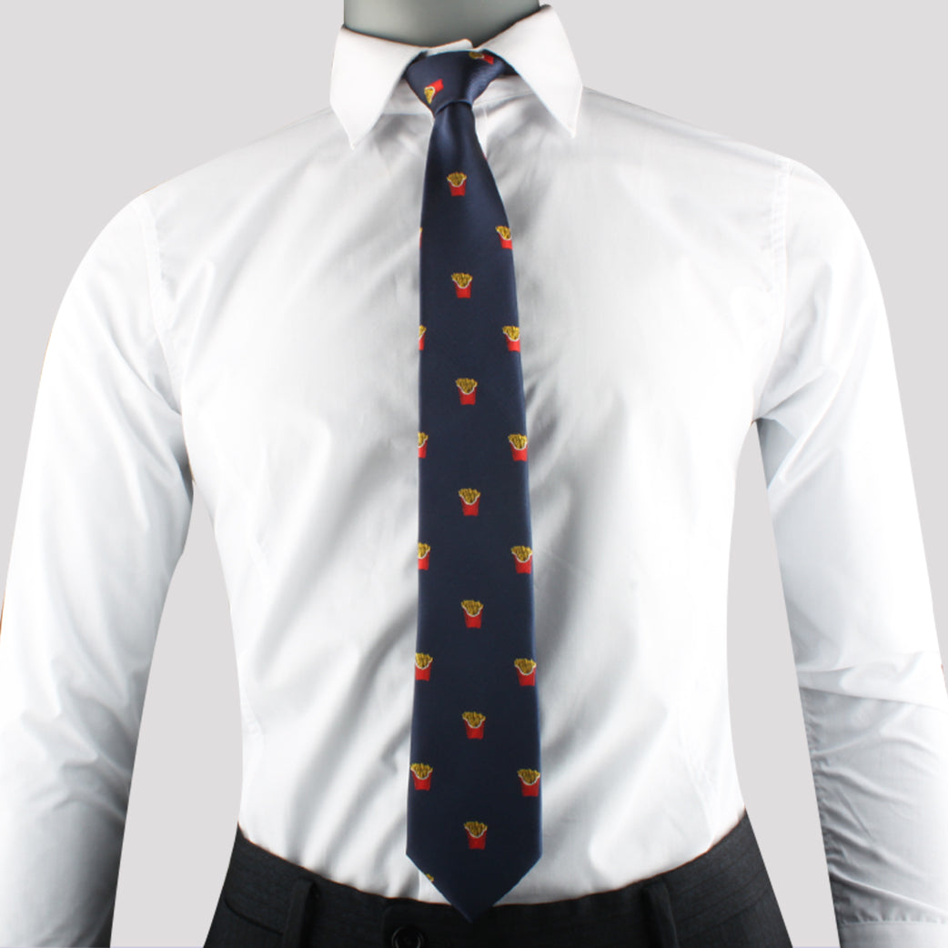 A person wearing a white dress shirt, the Fries Print Tie with small embroidered patterns in red and yellow, and dark gray trousers exudes modern sophistication.