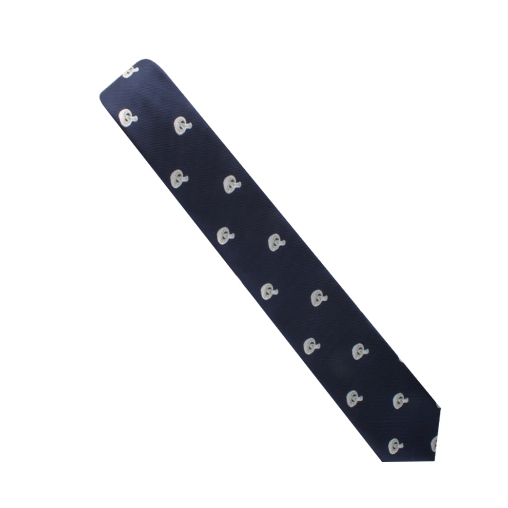 The Fungi Print Tie features a sophisticated design with a repeating pattern of small, white anchors set against a blue backdrop, exuding elegance.