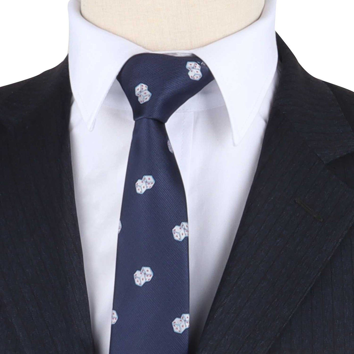 A close-up of a mannequin dressed in a dark suit with a white shirt and the Game Night Tie, featuring small patterned designs, exuding an air of sophisticated style.