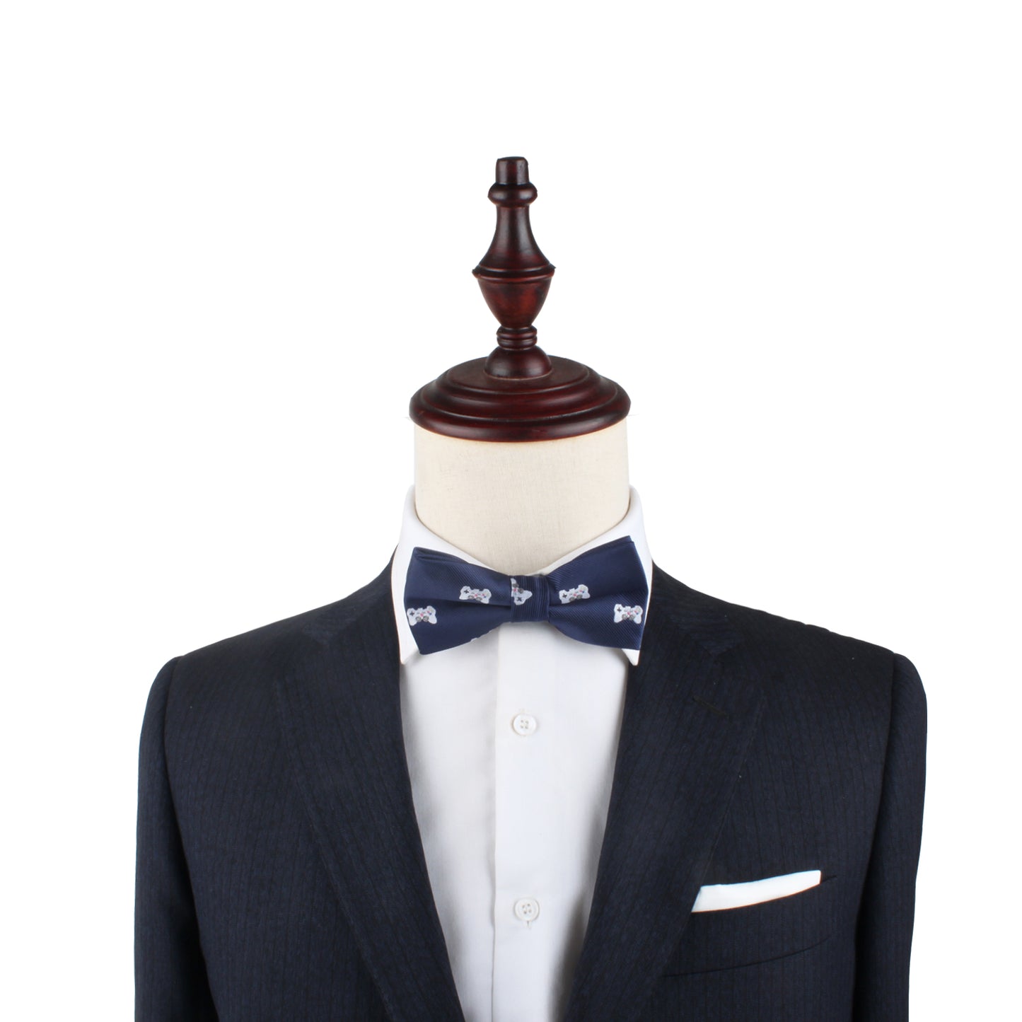 A mannequin dressed in a dark suit and white shirt wears the Gamer Bow Tie in navy blue with a subtle pattern, all set against a white background.
