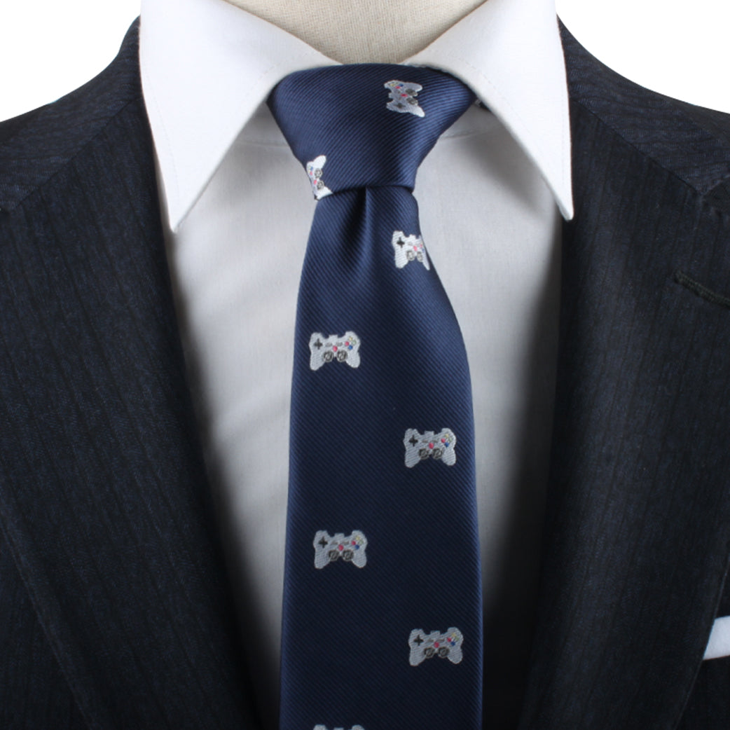 A close-up view of a person wearing a dark suit and white dress shirt with a Gamer Necktie, perfect for gamers who are also trendsetters.