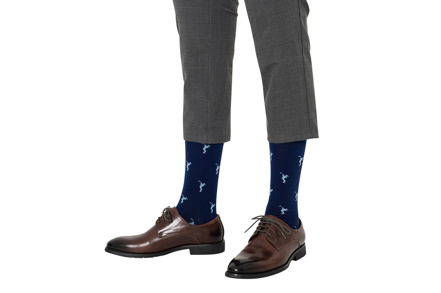 A man in a gray suit and Golf Swing Blue Socks.