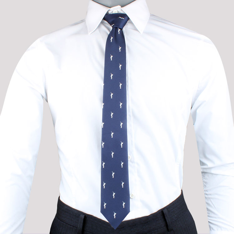 A person dressed in a white dress shirt, Golf Lover Tie, and dark trousers.