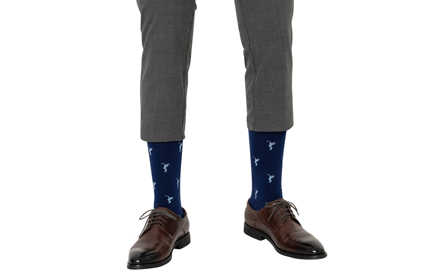 A man wearing a grey suit and Golf Swing Blue Socks.