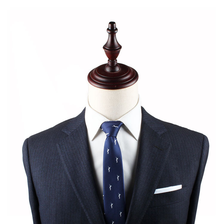 A tailored dark suit with a white dress shirt and a Golf Swing Thin Tie, displayed on a wooden mannequin against a plain white background.