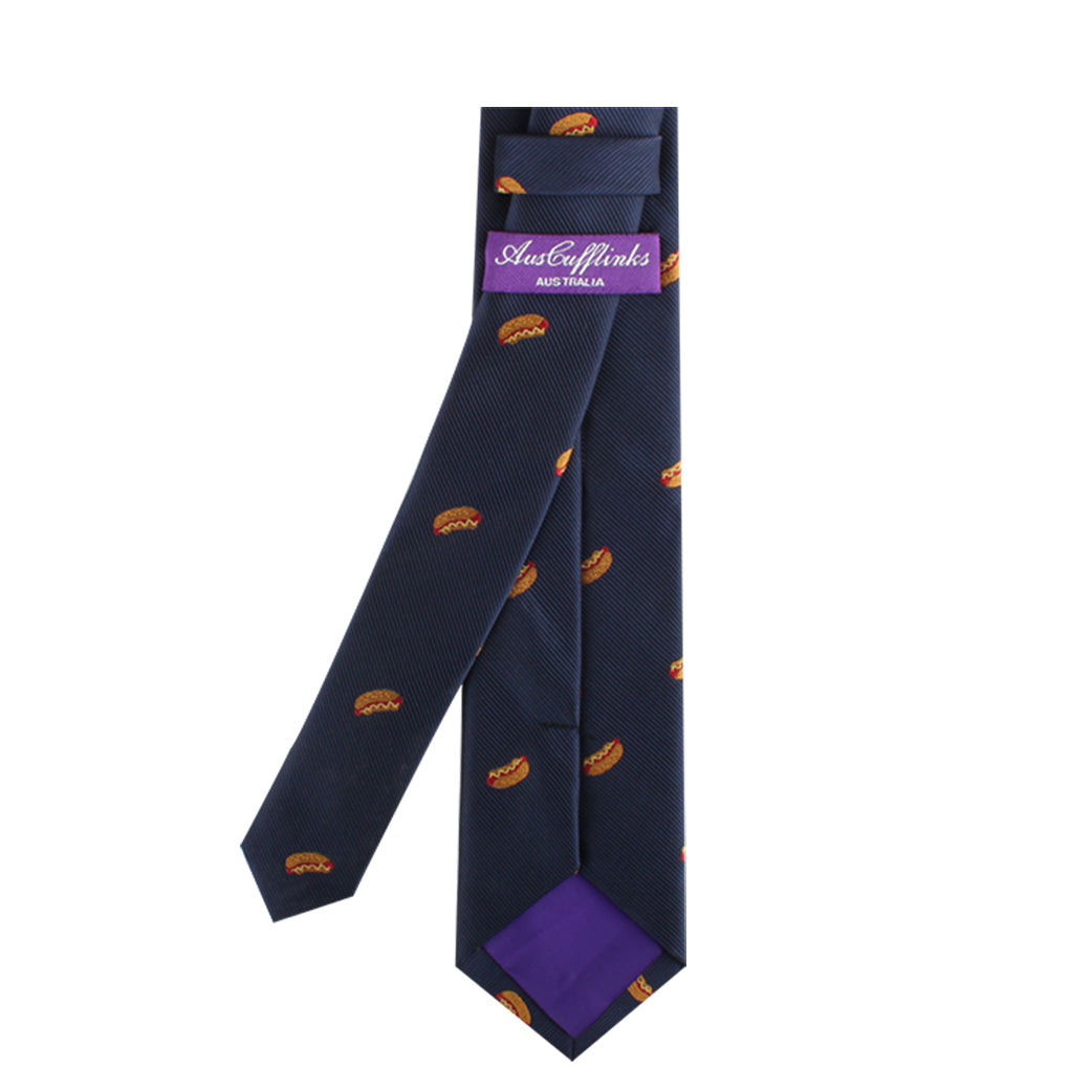 The navy blue Gourmet Food Tie, decorated with small orange burger patterns, exudes culinary charisma and features a purple label displaying the brand name "AustCufflinks Australia.