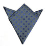 This stylish accessory, the Grey Blue Flower Pocket Square, showcases small blue floral patterns and is neatly folded in a triangular style.