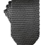 The Classic Grey Knit Tie, with its versatile texture and refined pattern, is elegantly folded against a white background.