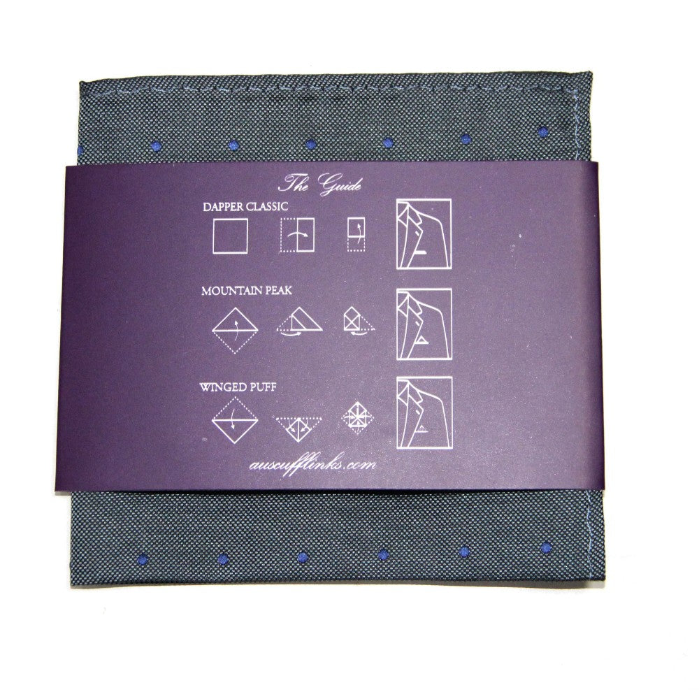 The Grey Navy Polka Dot Pocket Square comes with a purple guide featuring three fold styles: Dapper Classic, Mountain Peak, and Winged Puff. This elegant accessory elevates any suit ensemble with sophistication.