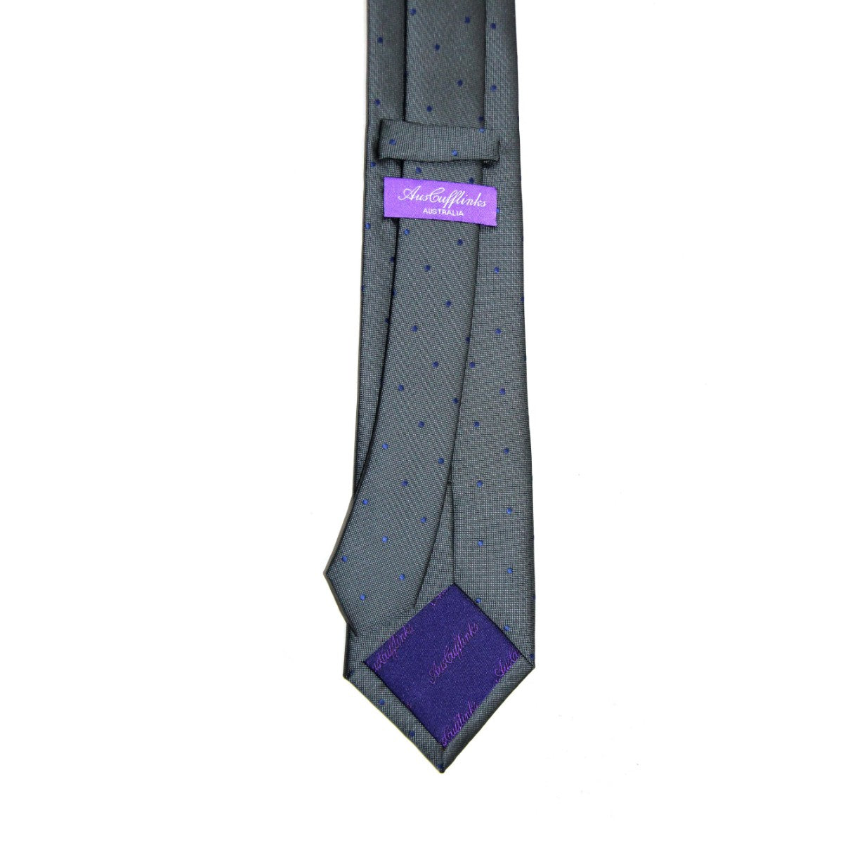 This sophisticated Grey Navy Polka Dot Business Tie & Pocket Square Set elevates your ensemble with subtle blue dots and refined style. It features a purple "Aster & Huxley" label on the back, perfect for the distinguished professional.