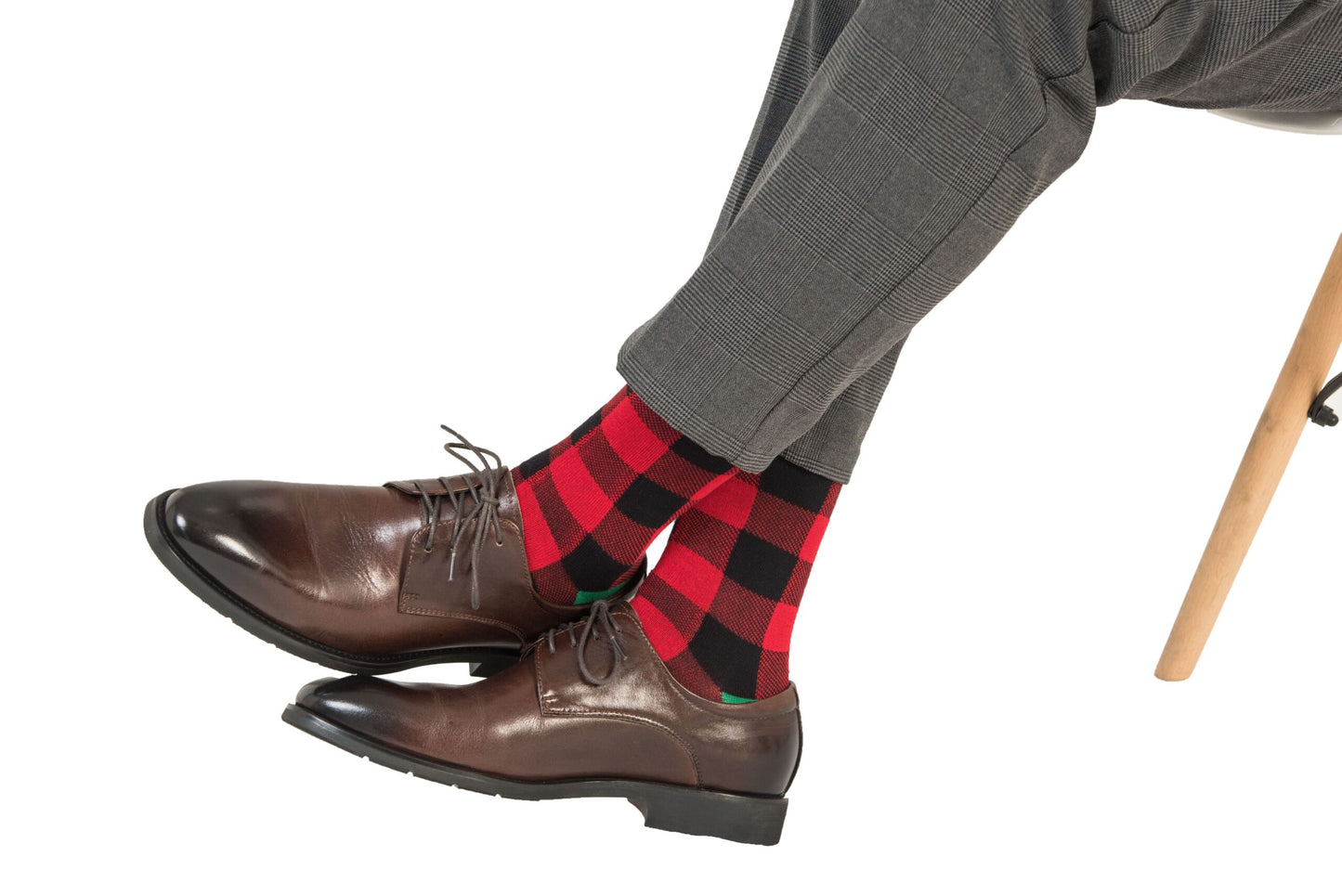 A man sitting on a chair wearing Cross Hatch Stripes socks.